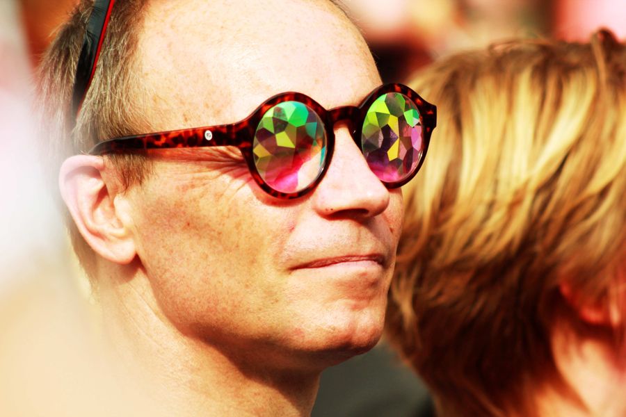 Man with Colorful Glasses in Outdoor Event