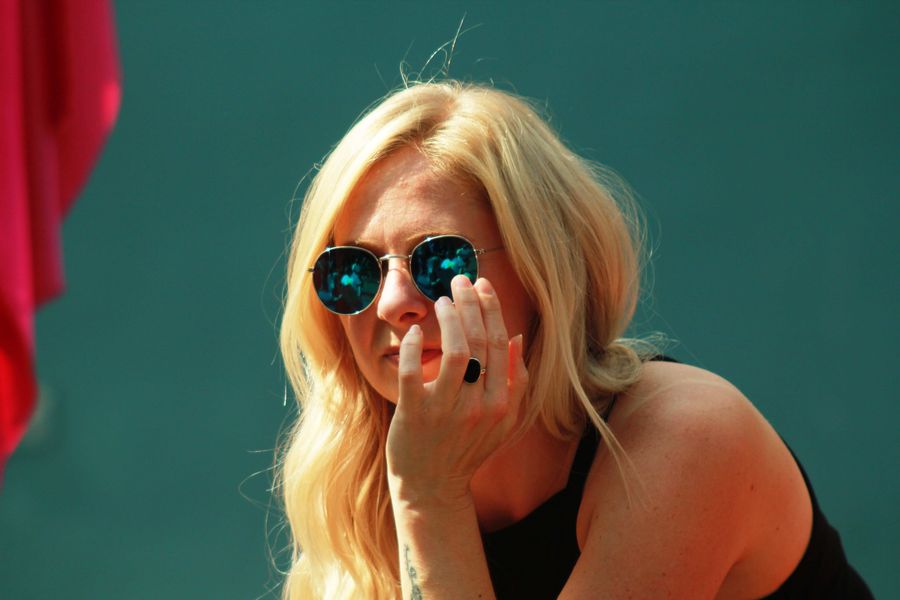 Blonde Girl with Sunglasses Chilling Out